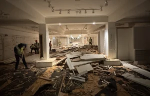 commercial interior demolition in Miami with wooden planks removed during early stage of renovation demolition commercial interior demolition project with removed wooden flooring and exposed subfloor during renovation preparation interior demolition contractors removing wood flooring during commercial building renovation early stage commercial interior demolition with broken wooden planks removed for renovation project commercial interior demolition with wood flooring removed during renovation commercial interior demolition in Miami with wooden planks removed during early stage of renovation demolition